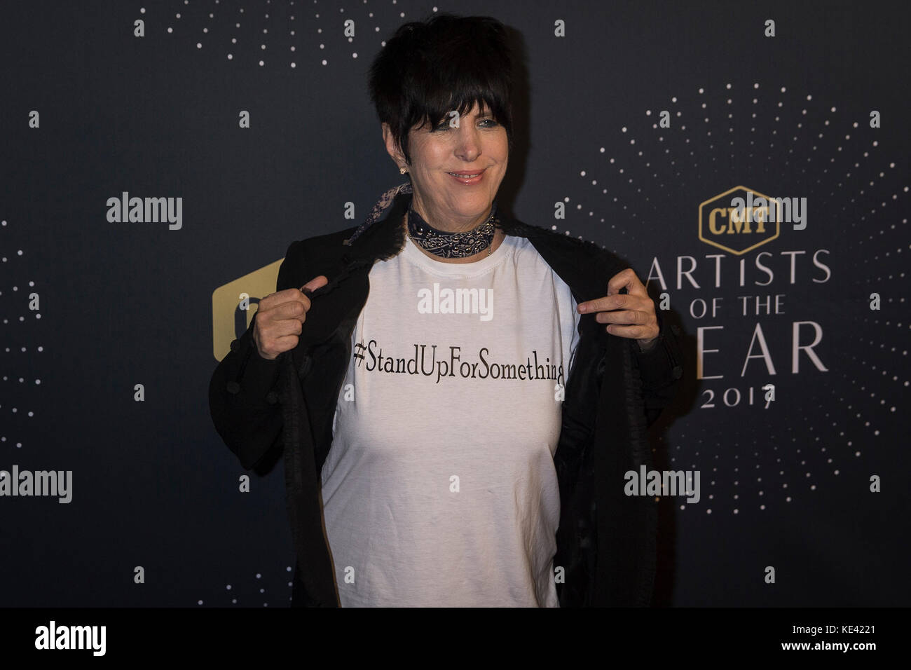 Nashville, Tenessee, USA. 18th Oct, 2017. NASHVILLE, TN - Songwriter Dianne Warren shows off a Stand Up For Something shirt on on the red carpet at the 2017 CMT Artists of the Year at the Schermerhorn Symphony Center in Nashville, TN. Credit: The Photo Access/Alamy Live News Stock Photo