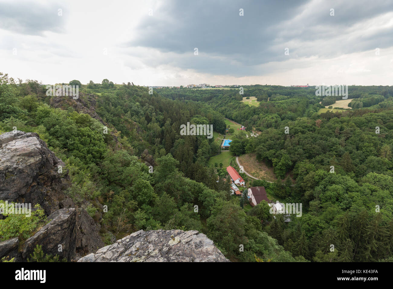 Lush gorge viewed from the rocky top at the Divoka Sarka. It's a nature reserve on the outskirts of Prague in Czech Republic. Stock Photo