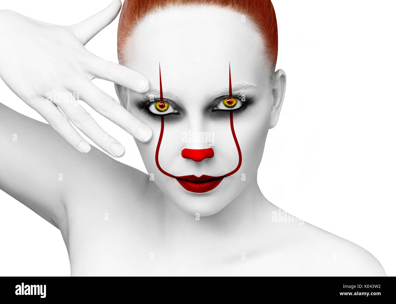 Redhead woman with scary clown grimm. Stock Photo