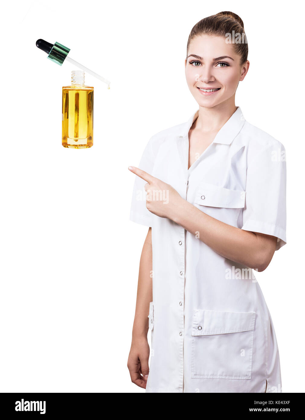 Young cosmetologist woman presents cosmetics oil. Stock Photo