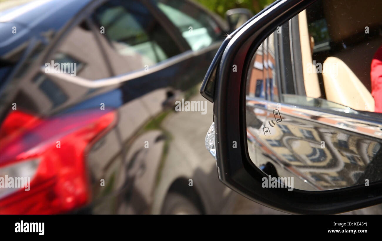 Blind Spot Monitoring system warning light icon in side view mirror of
