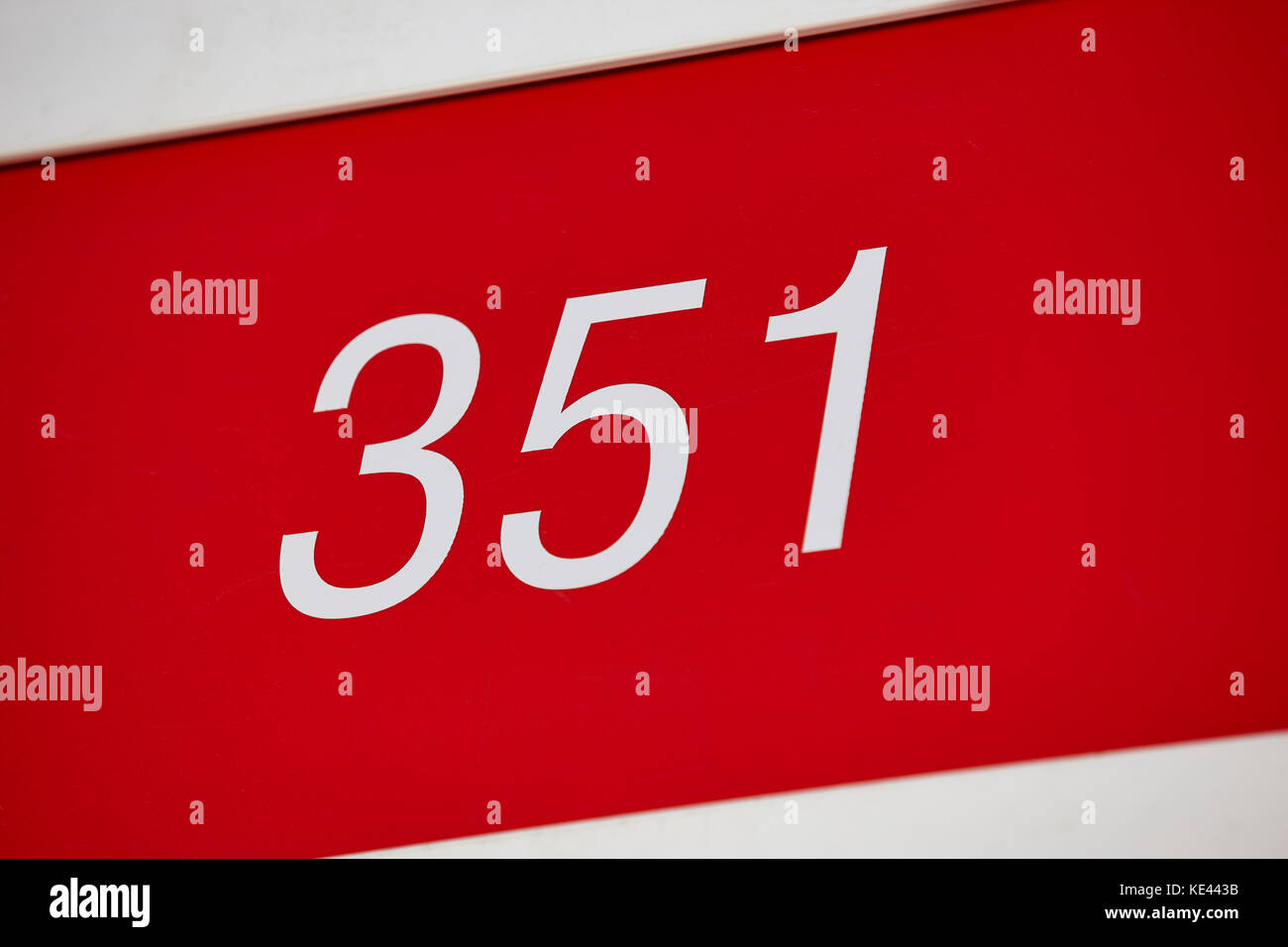Hotel room number in red and white. Tourist apartment. Vacation Stock Photo Alamy