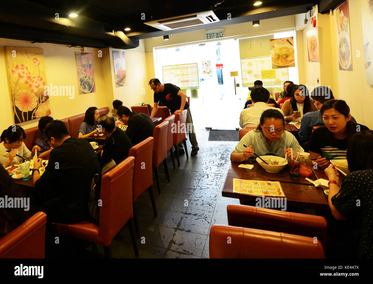 Lunchtime in a Hong Kong style Chinese restaurant in Sheung Wan, HK Island. Stock Photo