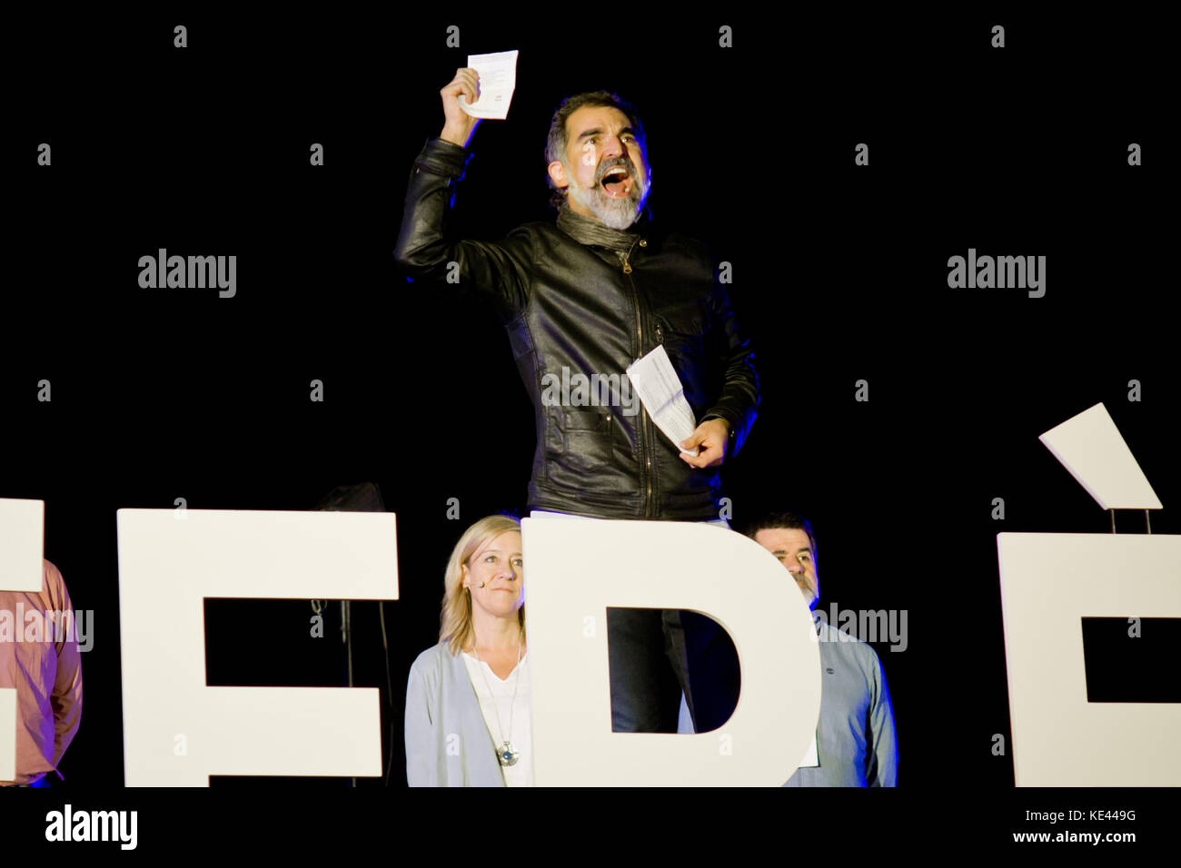 (File) In this image taken on September 29, 2017, leader of Omnium Cultural pro-independence organisation JORDI CUIXART shows a paper ballot  during the closing campaign meeting for the catalan independence referendum in Barcelona. Jordi Sánchez, who heads the Catalan National Assembly (ANC), and Jordi Cuixart, leader of Omnium Cultural, are being held without bail while they are under investigation for sedition. Stock Photo