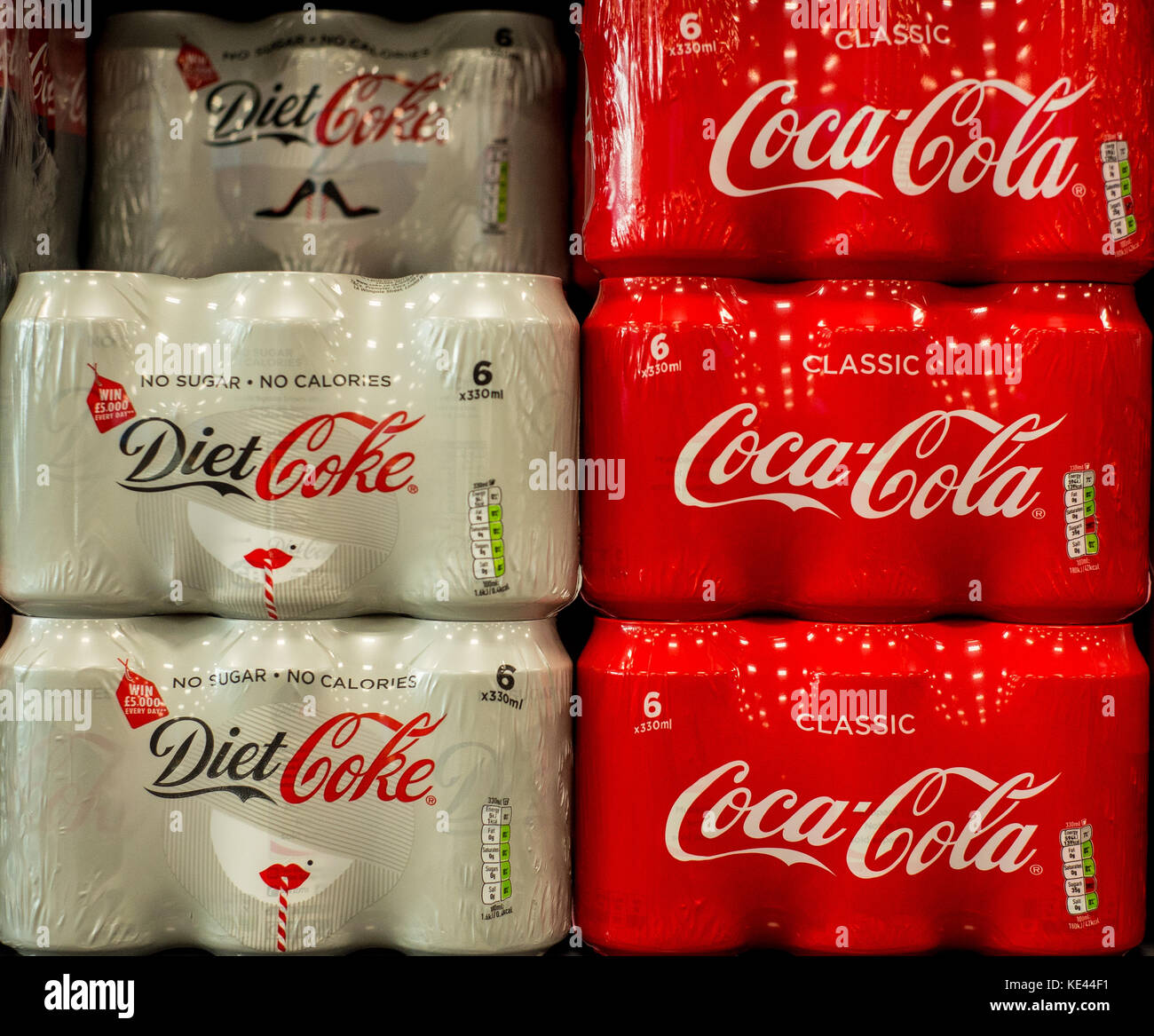 Coke and Diet coke stacked own the shelf in a UK Supermarket Stock Photo