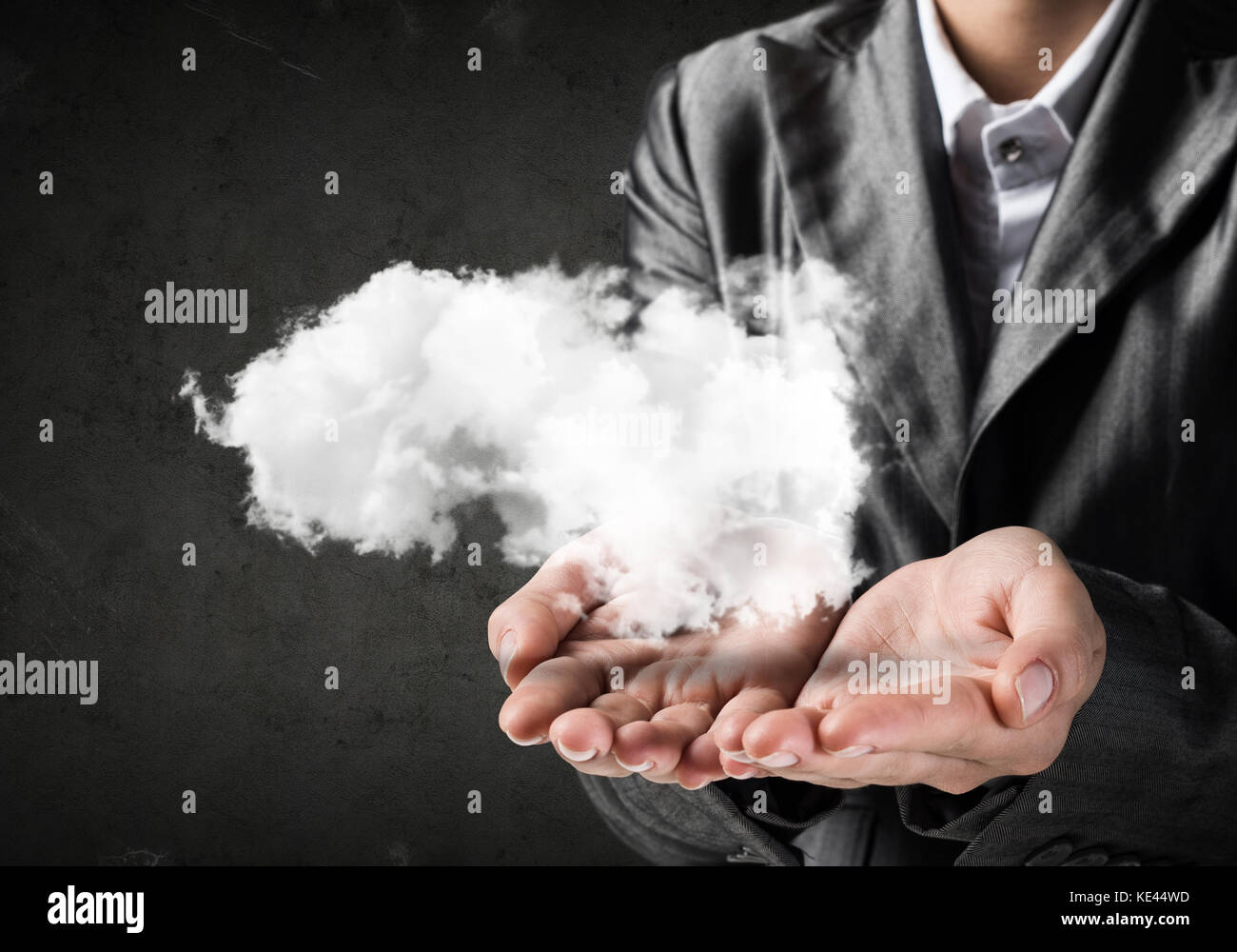 Woman presenting cloud in her hand Stock Photo - Alamy