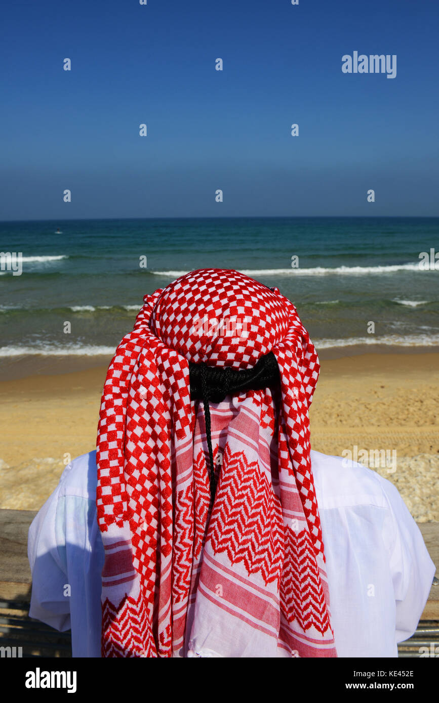 An Emarati man enjoying the ocean views. Stock Photo