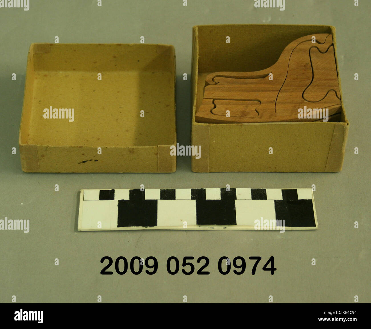 Wooden 3D Puzzle in the Shape of A Rocking Chair in Original Box Stock Photo