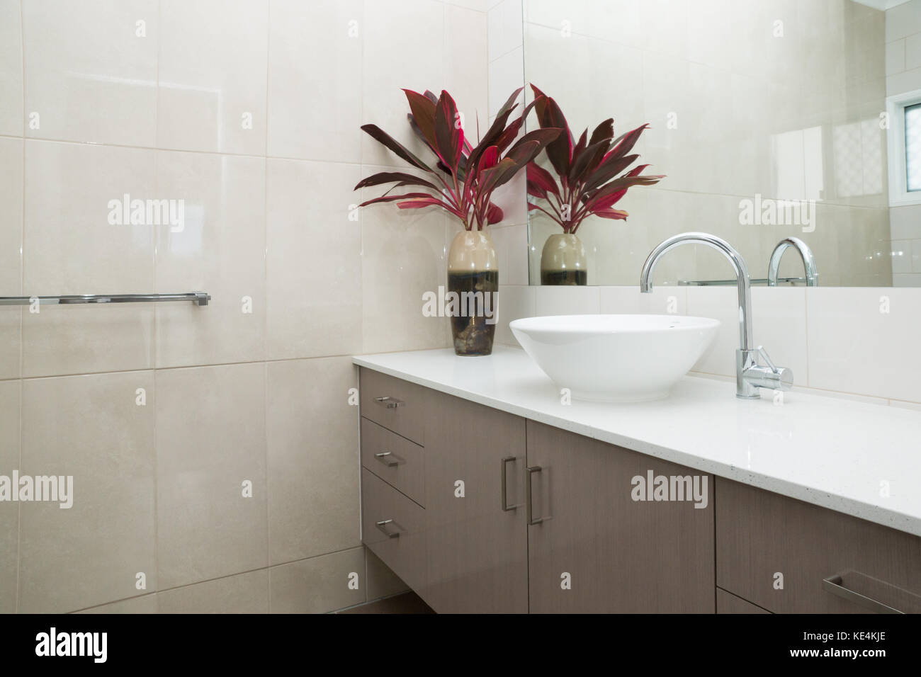 Contemporary bathroom with granite bench top and tiled walls Stock Photo