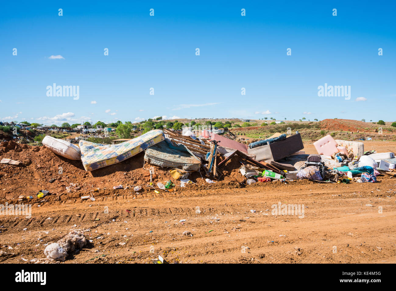 Household goods on rubbish heap at refuse collection site Stock Photo