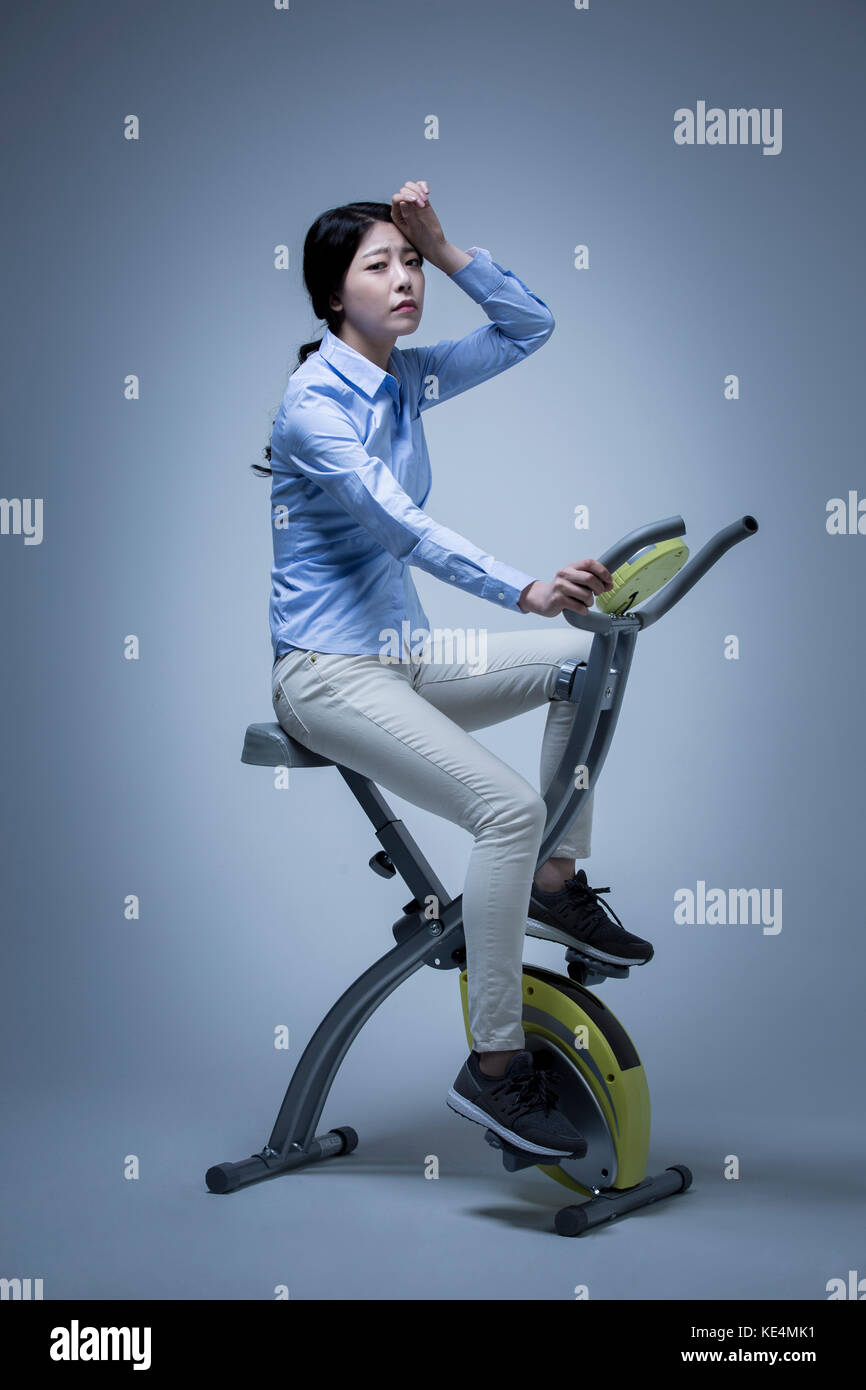 Side view of young woman tired exercising Stock Photo Alamy