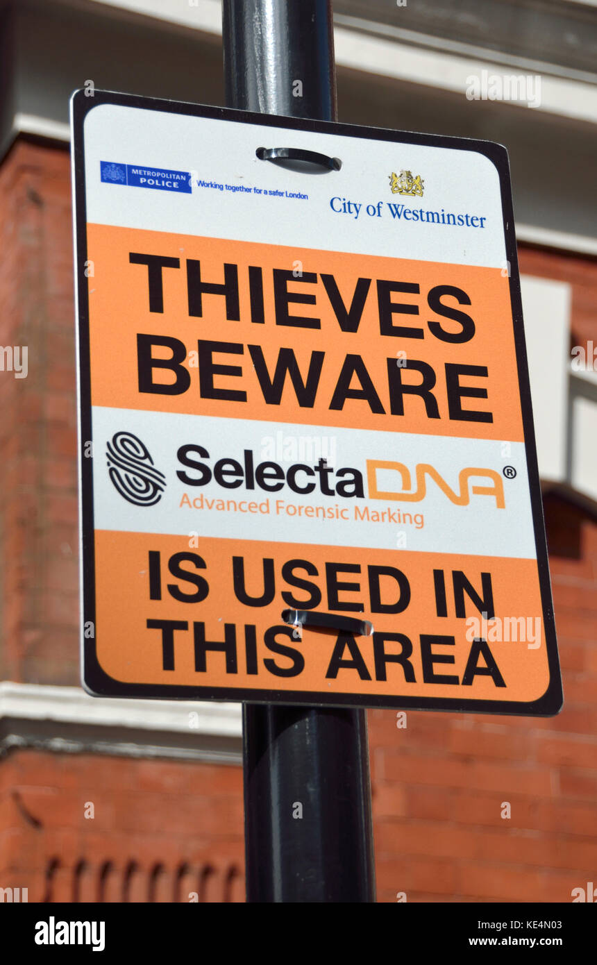 ’Thieves beware SelectaDNA used in this area’ warning sign in a London street. Stock Photo