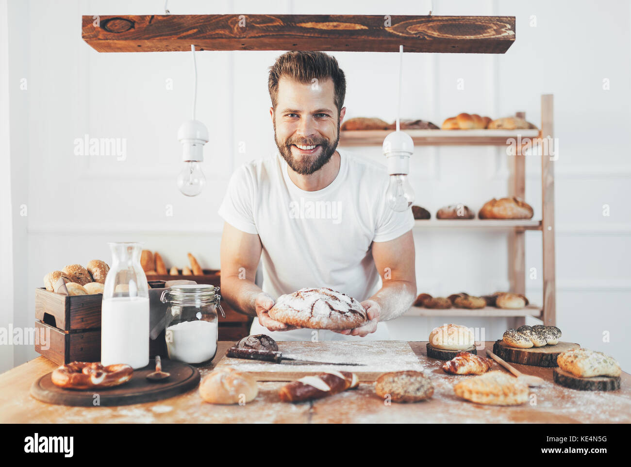 Baker with a variety of healthy and delicious freshly baked bread and