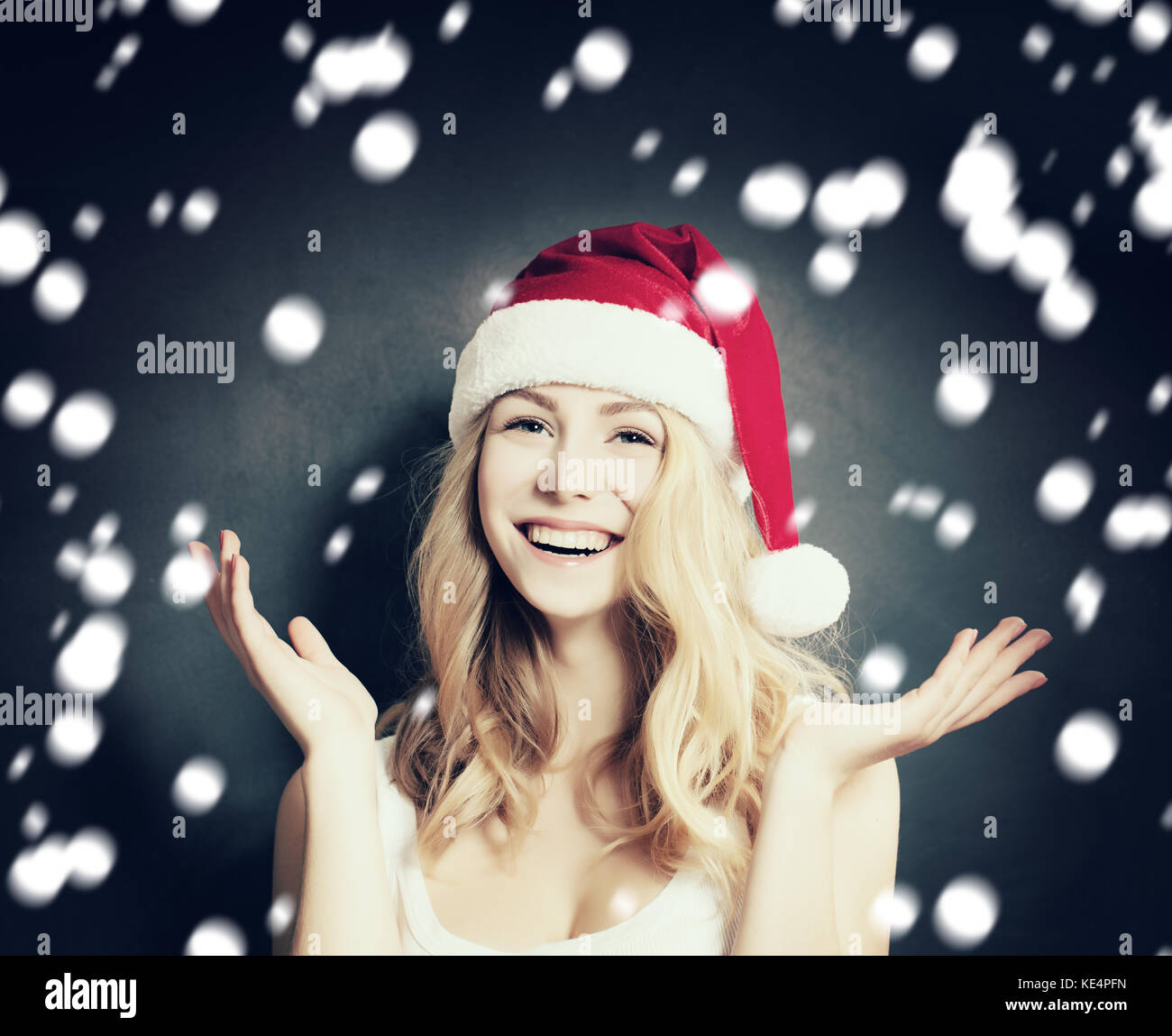 Beautiful blonde woman in santa hi-res stock photography and images - Alamy