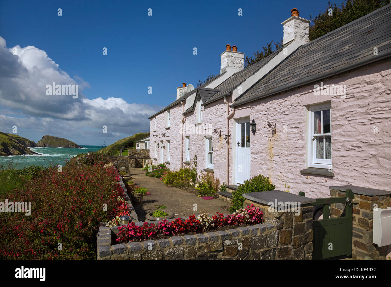 Pink holiday cottages at Abercastle. Stock Photo