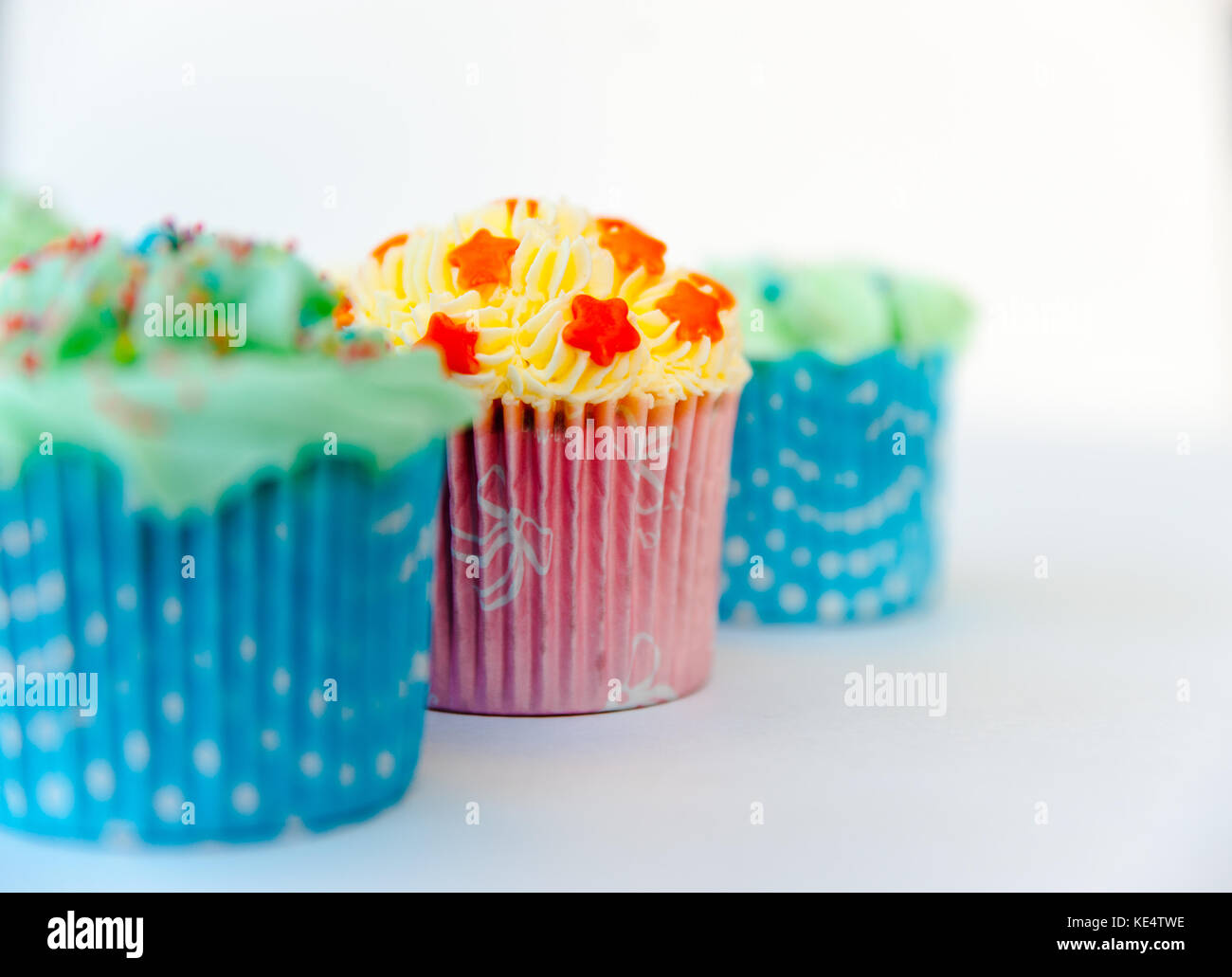 Homemade, colorful cupcakes with white background Stock Photo