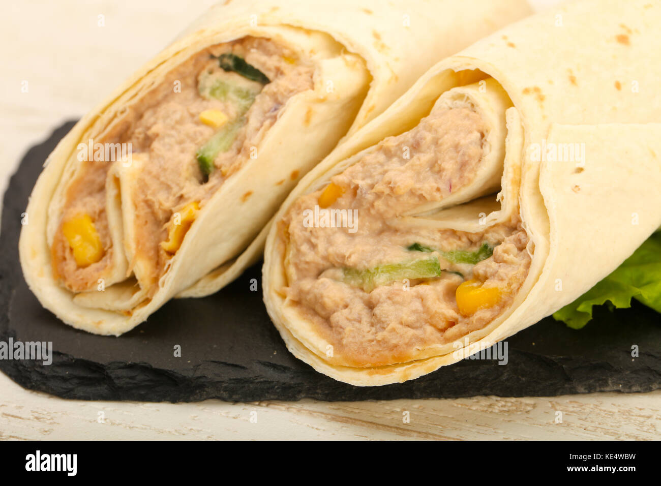 Tuna bread roll with salad leaves Stock Photo - Alamy