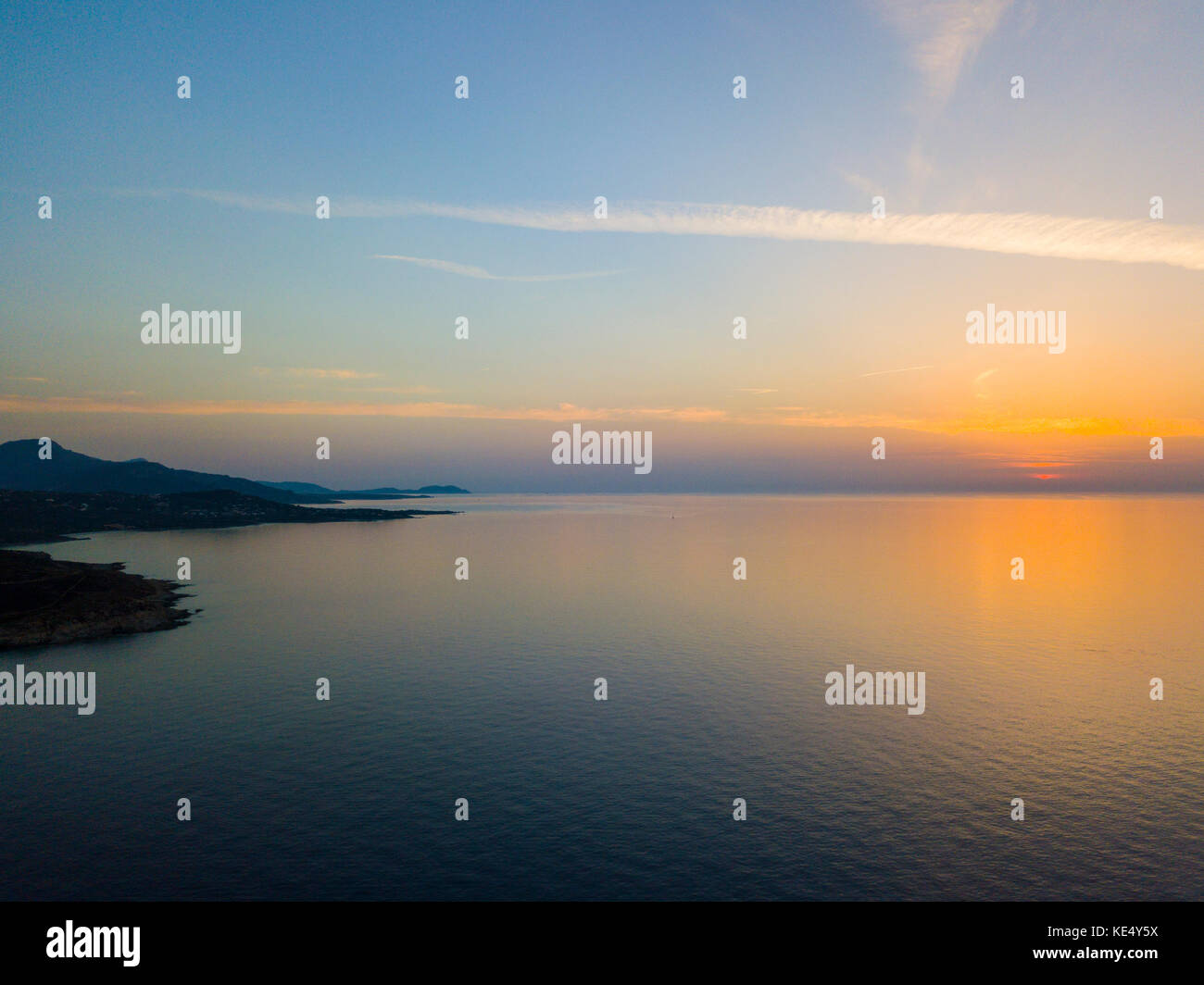 Aerial view of Corsica coast at sunset, promontories bordering the sea. France Stock Photo