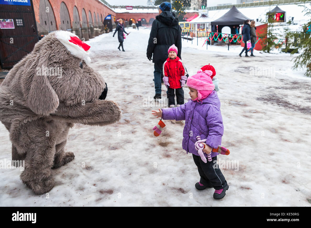 Hamina, Finland - December 13, 2014: Christmas fair in Hamina bastion, animators in animal costumes dance with children Stock Photo