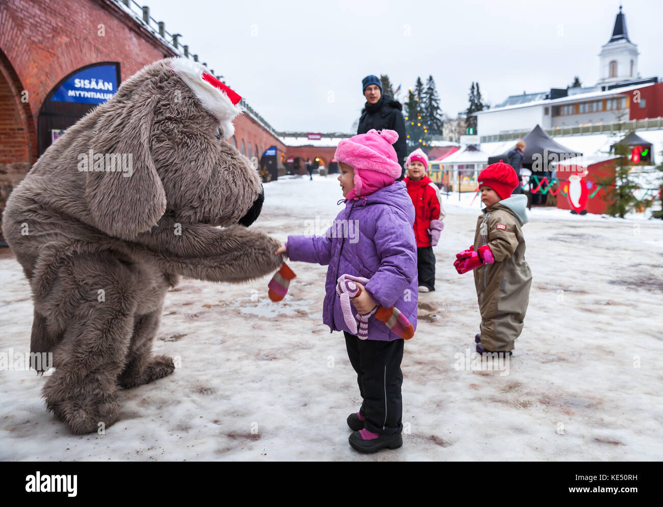 Hamina, Finland - December 13, 2014: Christmas fair in Hamina bastion, animators in animal costumes play with children Stock Photo