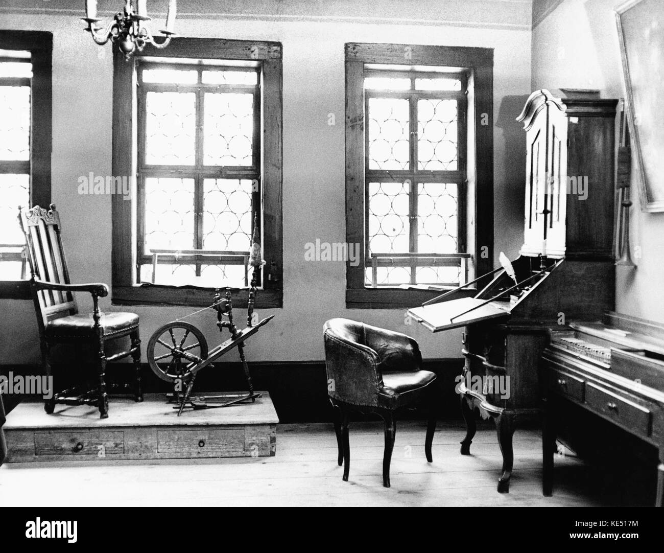 Johann Sebastian Bach - exhibition on the life of the German composer 's family, at his house in Eisenach (near Erfurt, Germany),  Spinning wheel, desk, & chair. Interior. JSB: 21 March 1685 - 28 July 1750. Stock Photo
