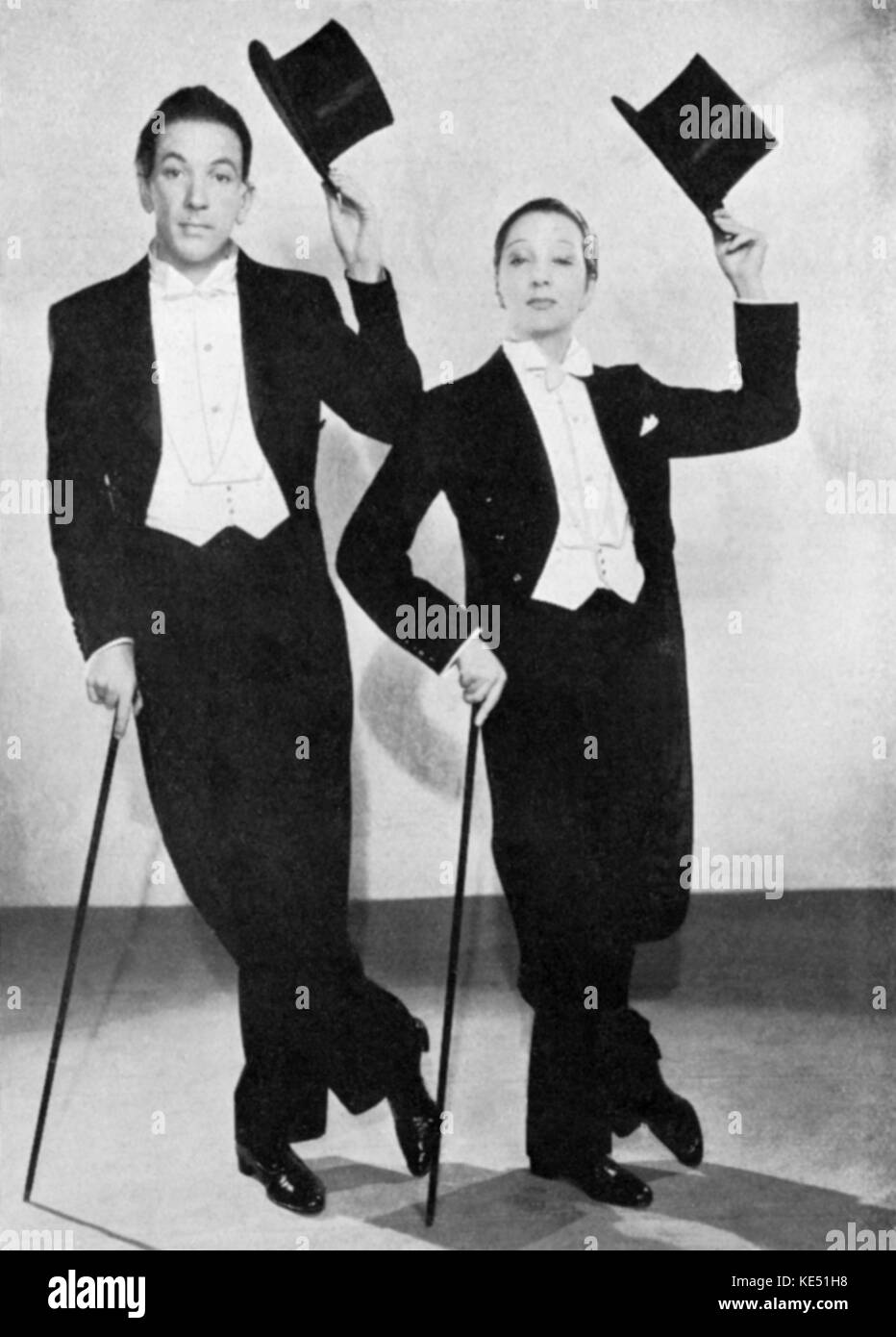 Noel Coward & Gertrude Lawrence in the musical 'The Red Peppers', 1936. NC, English actor, playwright, & composer: 16 December 1899 - 26 March 1973. GL, English actress & musical performer: 4 June 1898 - 6 September 1952. Top hats. Stock Photo