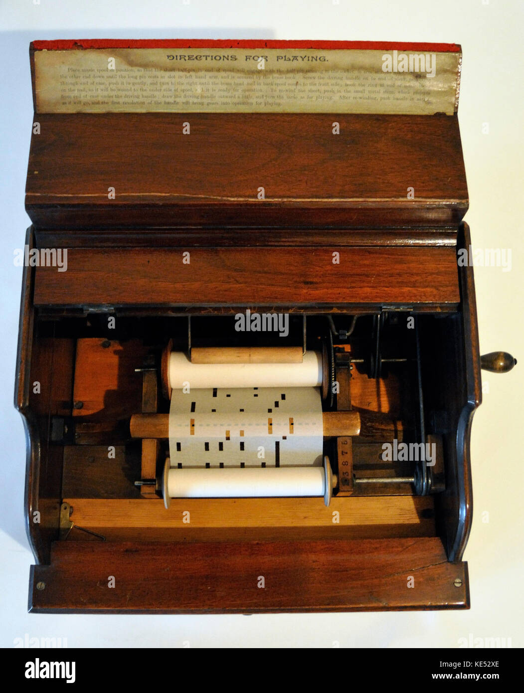Celestina Organette Interior The Improved Celestina model. 20 - note. 1890s.  Handle is turned whle perforated paper rolls are played on a loop.  Similar sound to hurdy-gurdy. Stock Photo