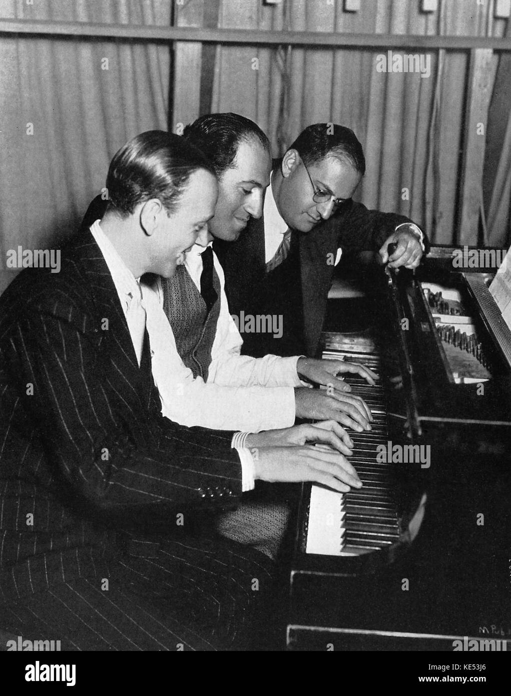 Fred Astaire. George and Ira Gershwin in rehearlalfor 'Shall We Dance'.    American composer & pianist, 26th September 1898 - 11th July 1937 Stock Photo