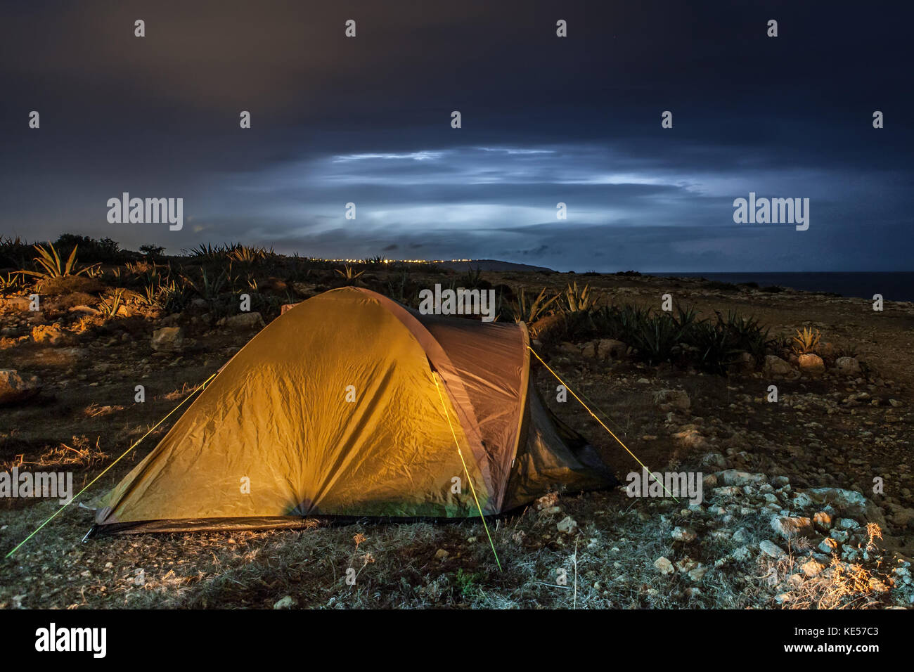 A camping tent set up during a thunderstorm Stock Photo Alamy