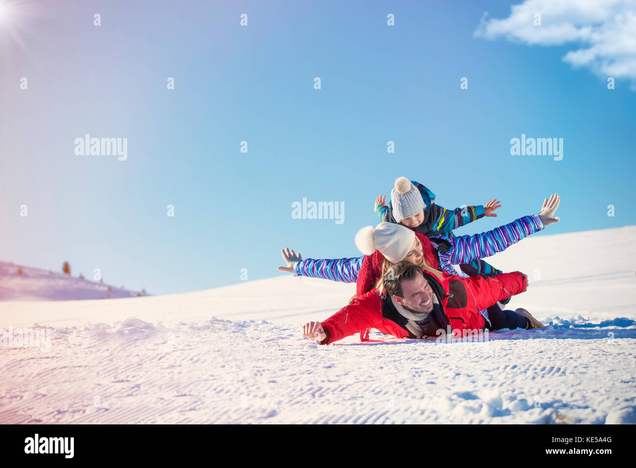Ski, snow sun and fun - happy family on ski holiday Stock Photo