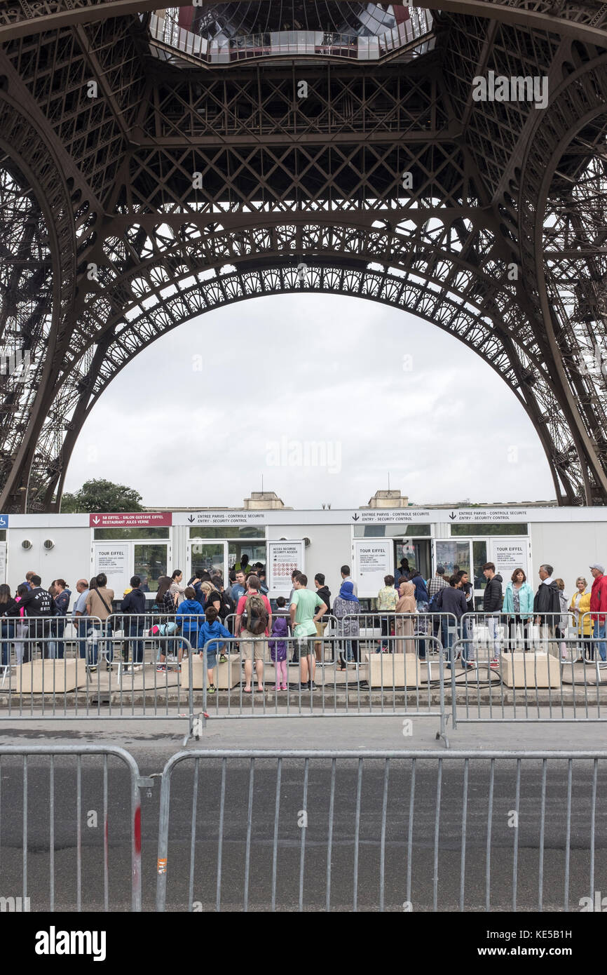 Tourists line up to buy tickets to go up the Eiffel Tower in Paris, France Stock Photo