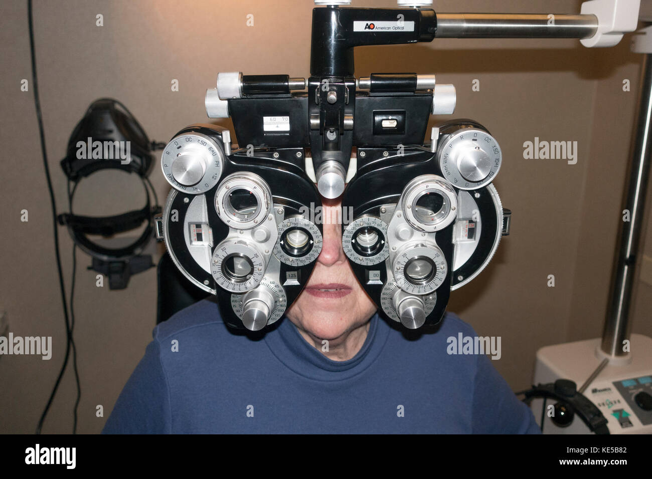 Patient's eyes being tested with a Phoropter in an Ophthalmologist office. Minneapolis Minnesota MN USA Stock Photo
