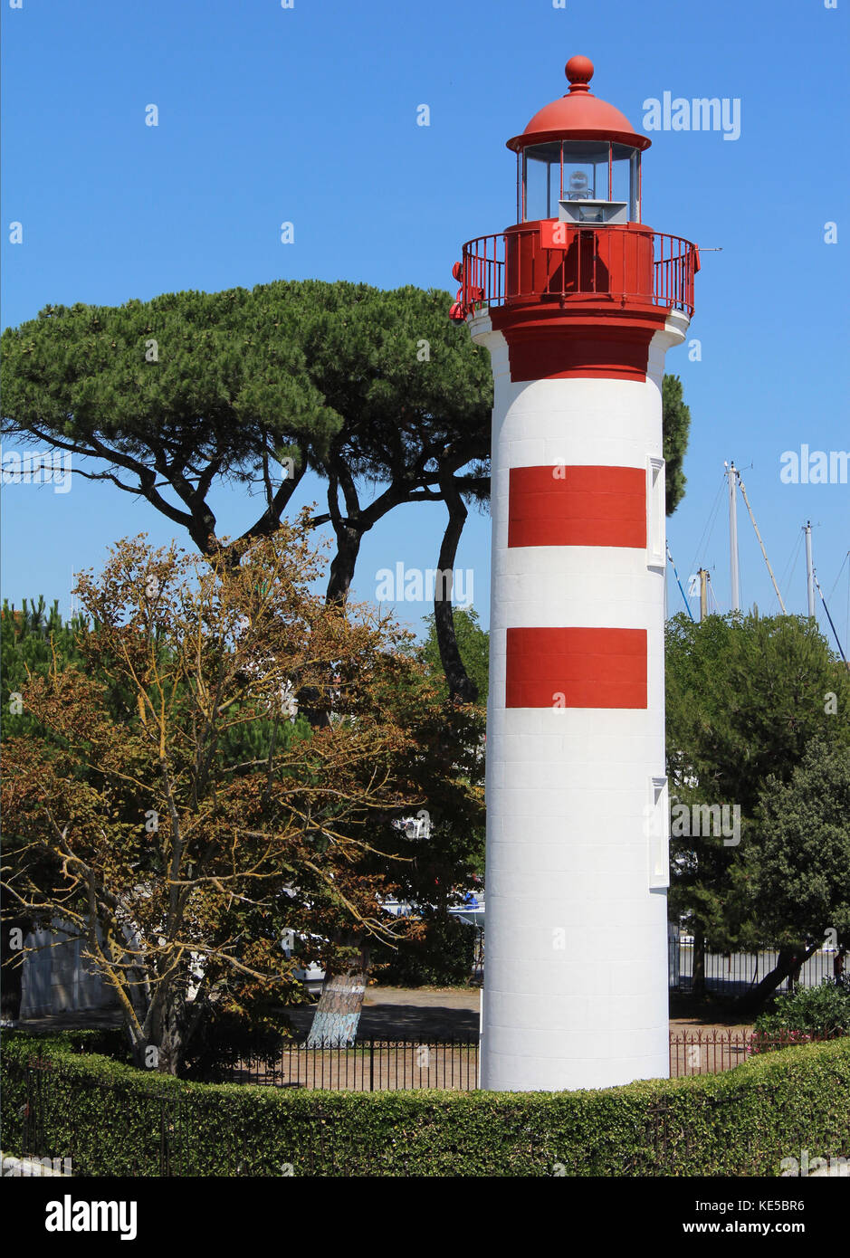 Red and White Lighthouse at the entrance to the old harbour in La Rochelle, France. Stock Photo