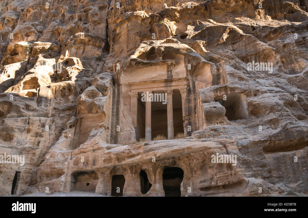 Nabataean Triclinium ruin carved in red sandstone cliff, Little Petra gorge, Siq al-Barid, archaeological site, Wadi Musa, Jordan, Middle East Stock Photo