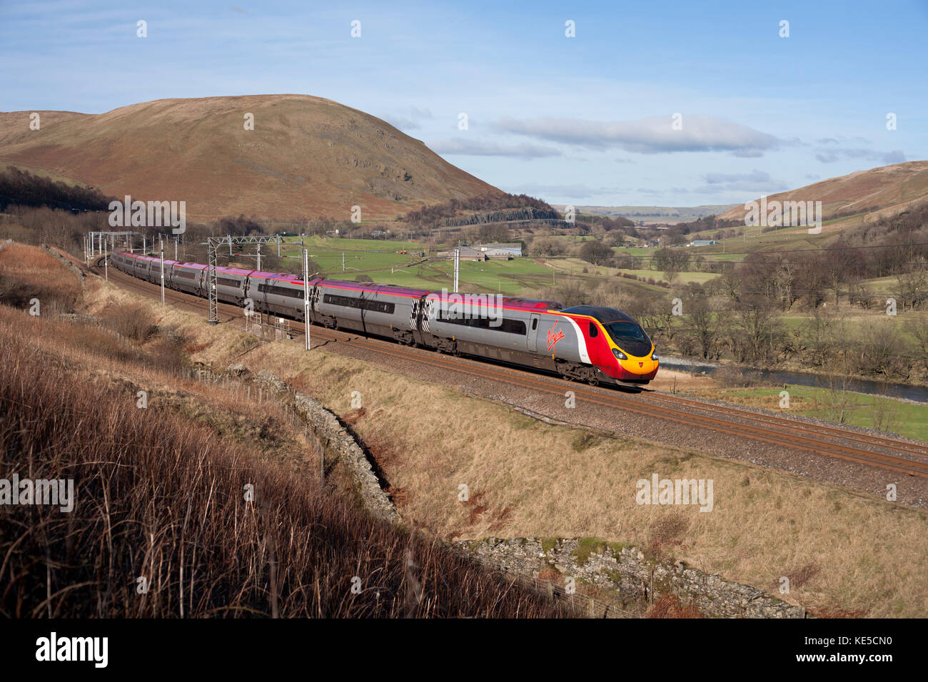 Virgin Trains west coast Pendolino train  passing through the Lune Gorge (South of Tebay, Cumbria) with  a Carlisle to London service Stock Photo