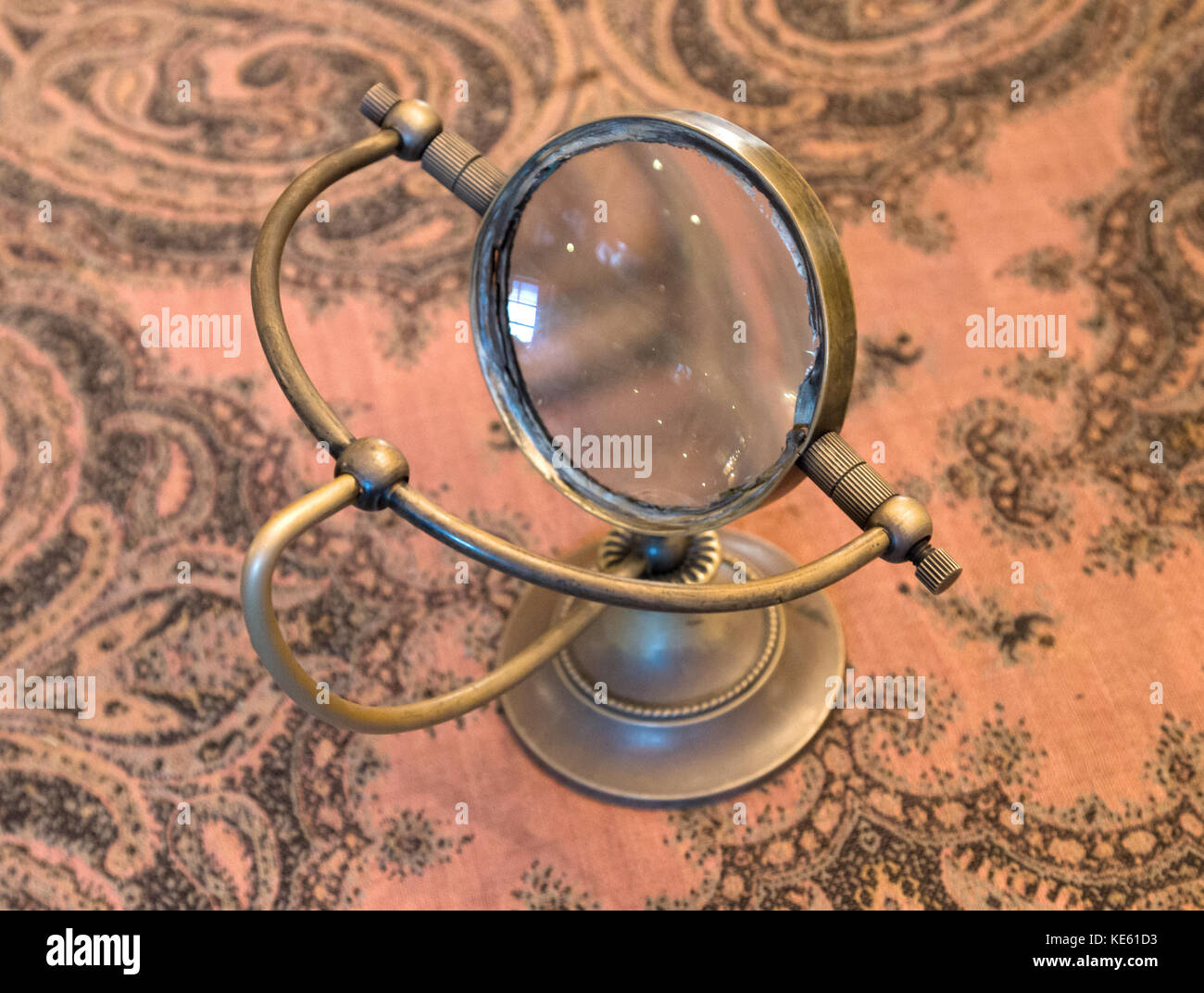 Vintage magnifier loupe standing on a table - Selective focus Stock ...