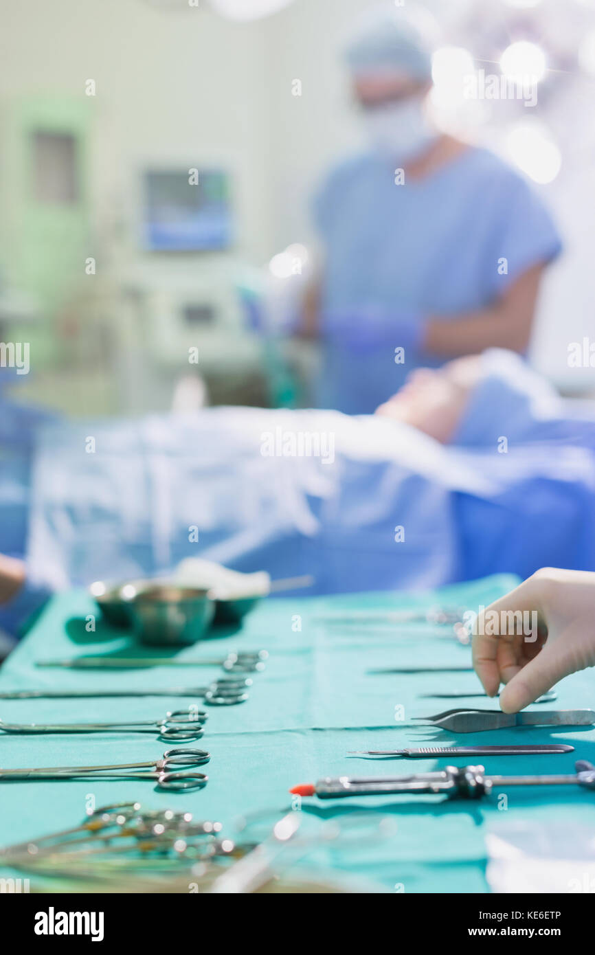 Nurse arranging surgical instruments on tray in operating room Stock ...