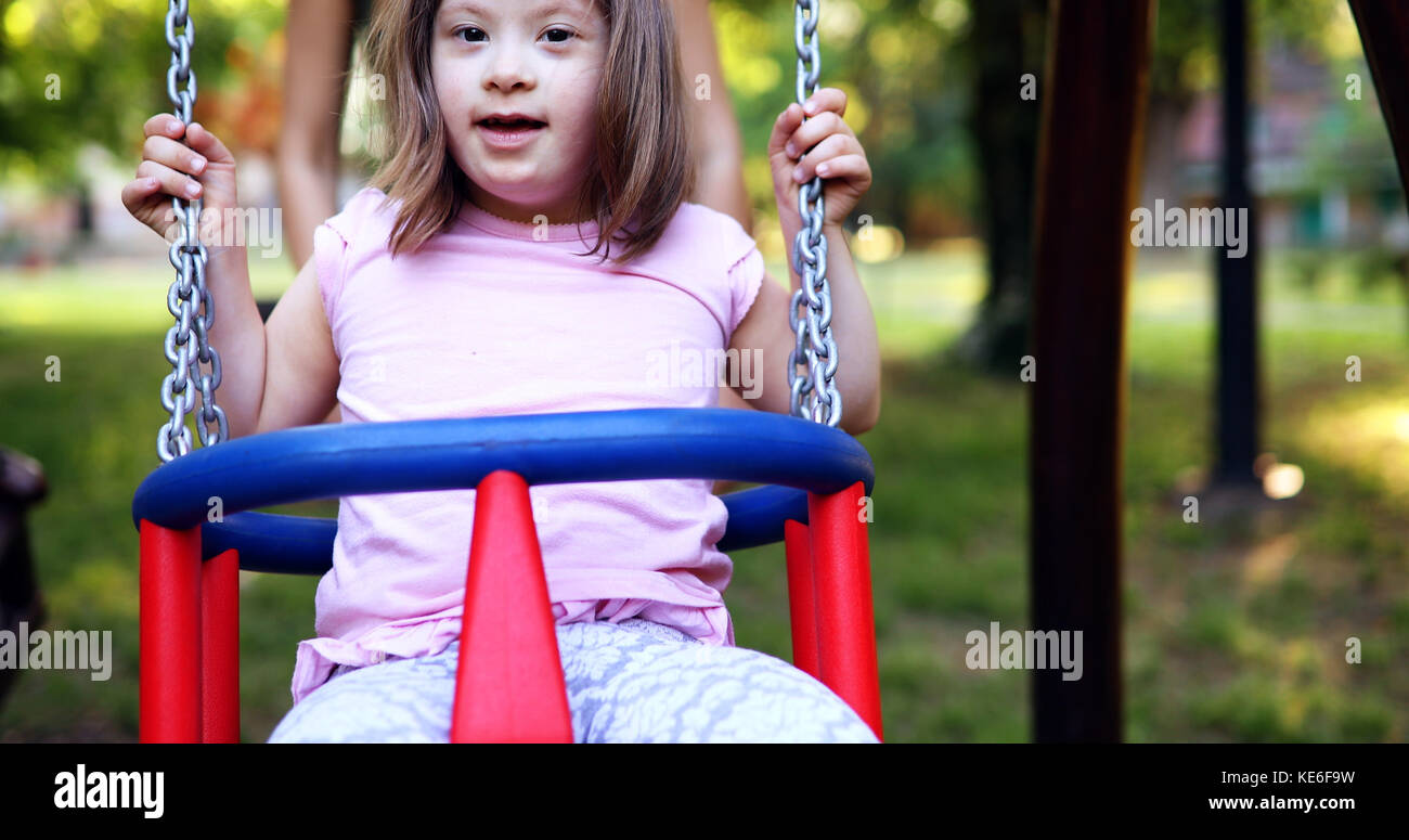 Portrait of beautiful little girl with down syndrome Stock Photo