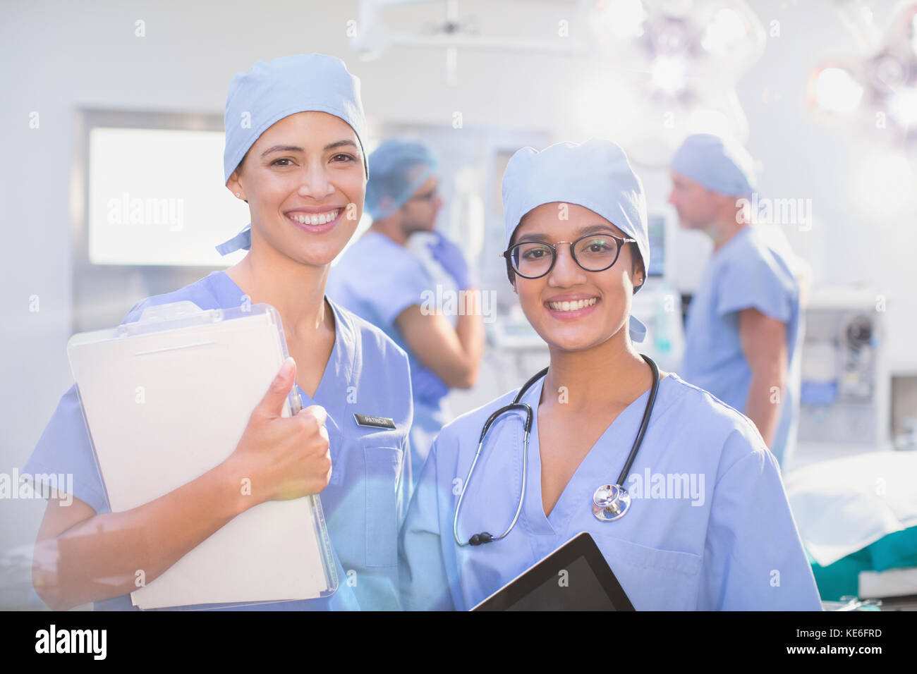 Portrait smiling, confident female surgeons in operating room Stock ...