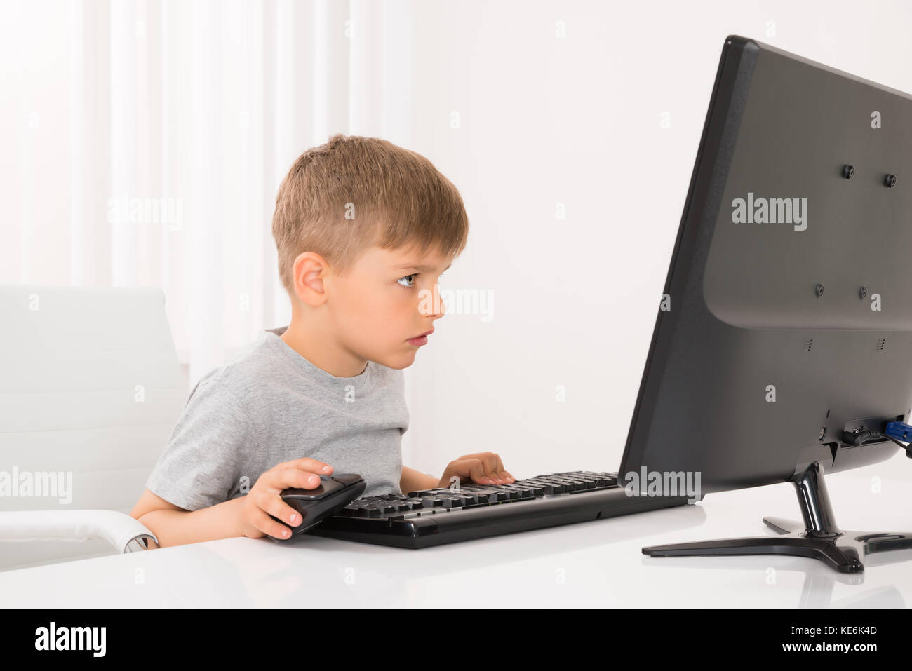 wallpapers Little Kid On Computer Stock Image https www alamy com stock image photo of little boy using computer at home 163645229 html