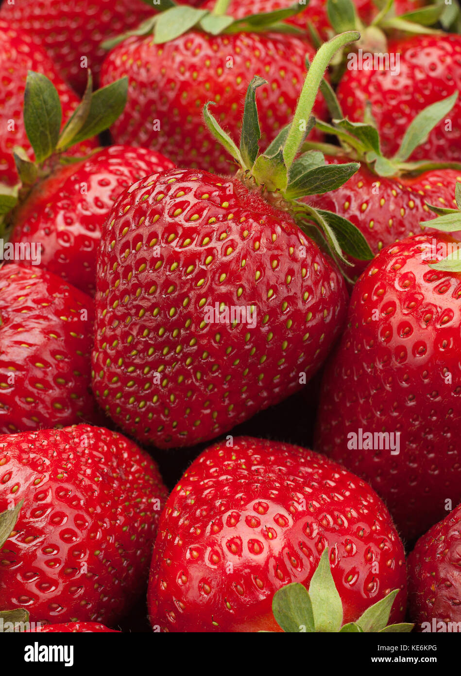 Ripe strawberry fruit berry closeup background Stock Photo - Alamy