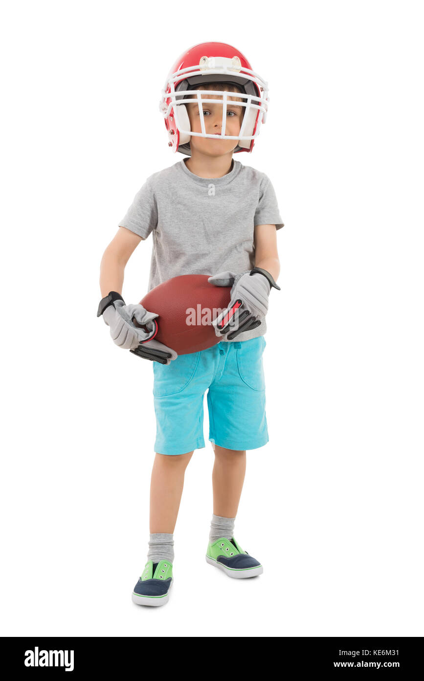 Boy In Sports Helmet Holding Rugby Over White Background Stock Photo