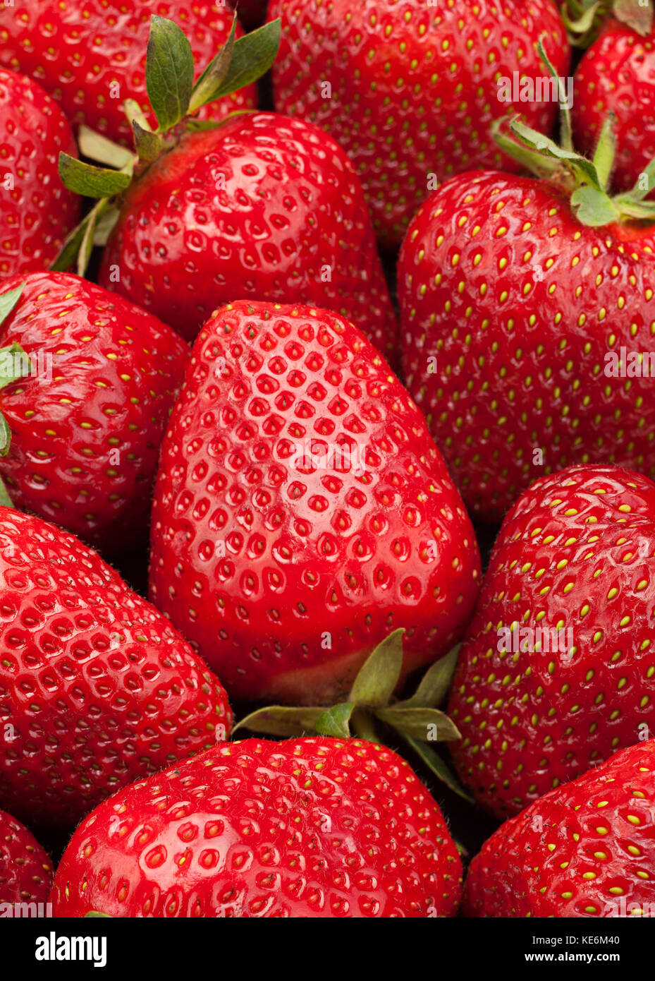 Ripe strawberry fruit berry closeup background Stock Photo - Alamy