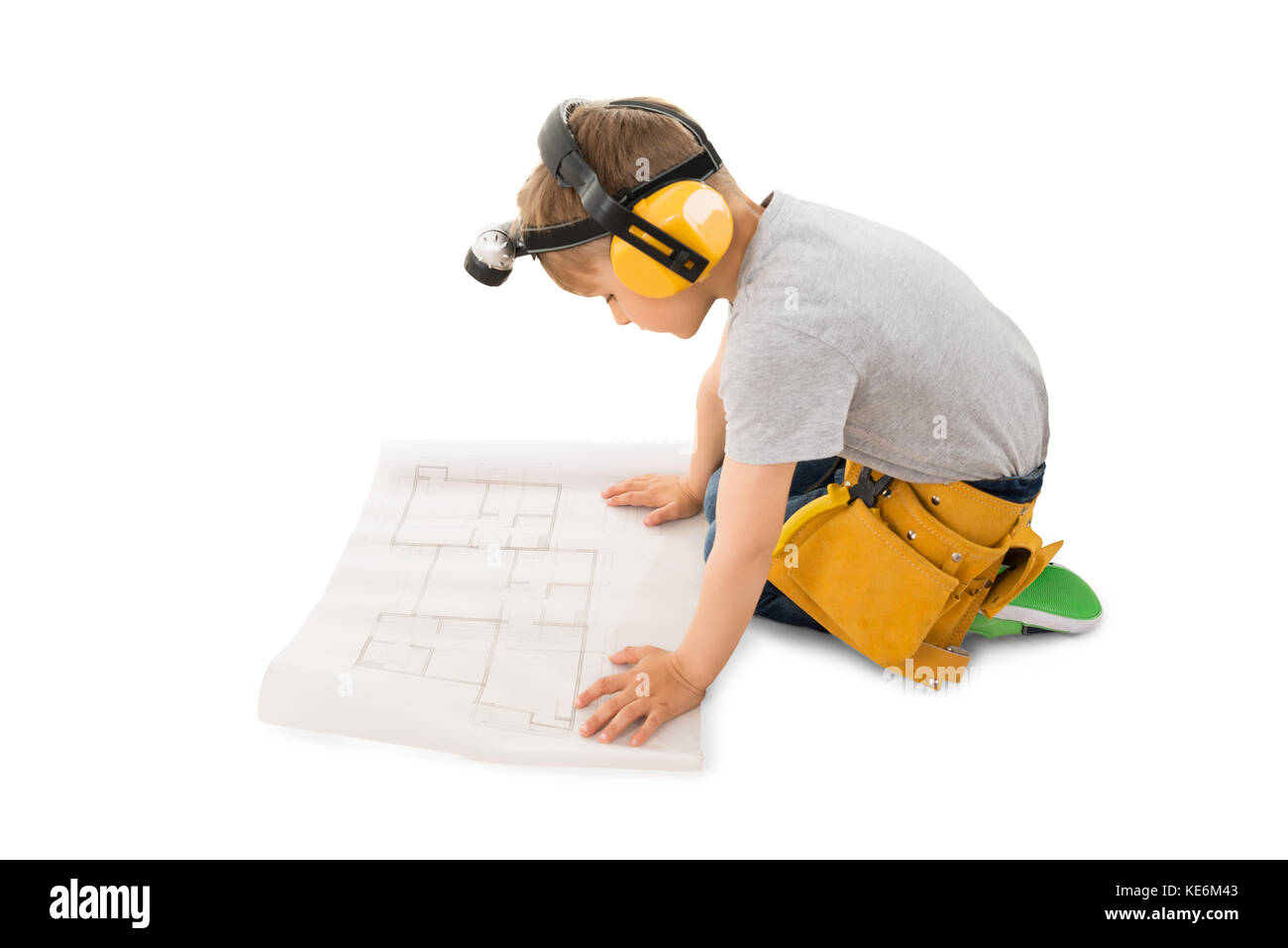 Cute Little Boy Looking At Blueprint Isolated On White Background Stock Photo