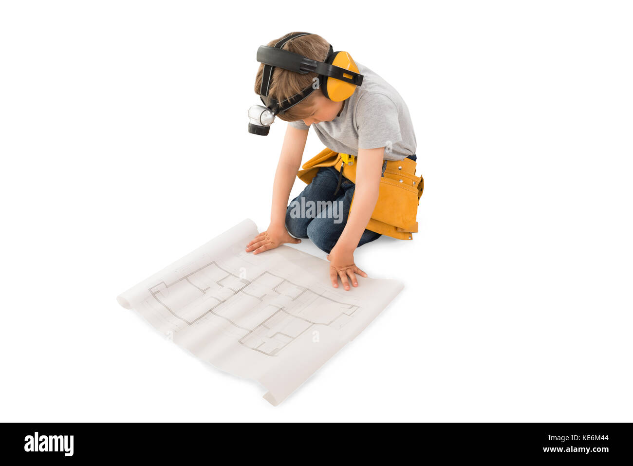 Cute Little Boy Looking At Blueprint Isolated On White Background Stock Photo