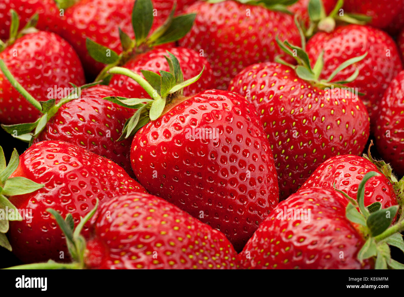 Ripe strawberry fruit berry closeup background Stock Photo - Alamy