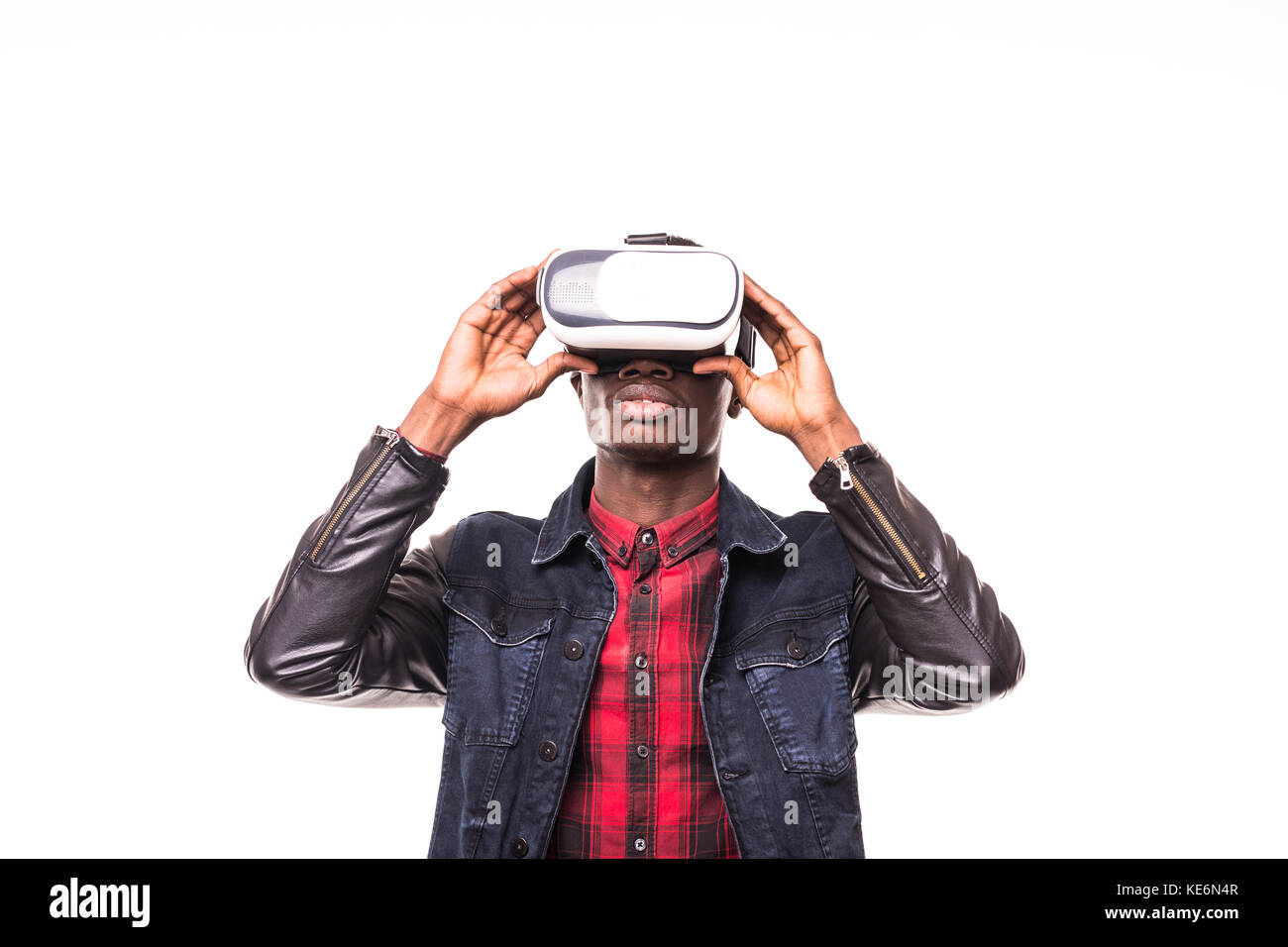 African American young man wearing vr virtual reality headset over ...