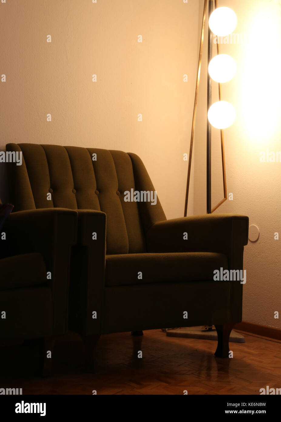 old armchair and vintage lamp in an old living room Stock Photo - Alamy
