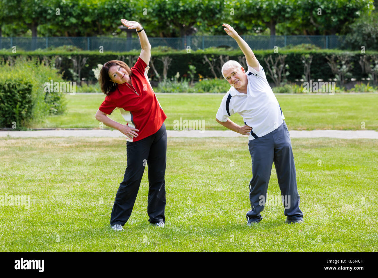 Active Senior Couple Doing Work Out In Park At Morning Stock Photo - Alamy