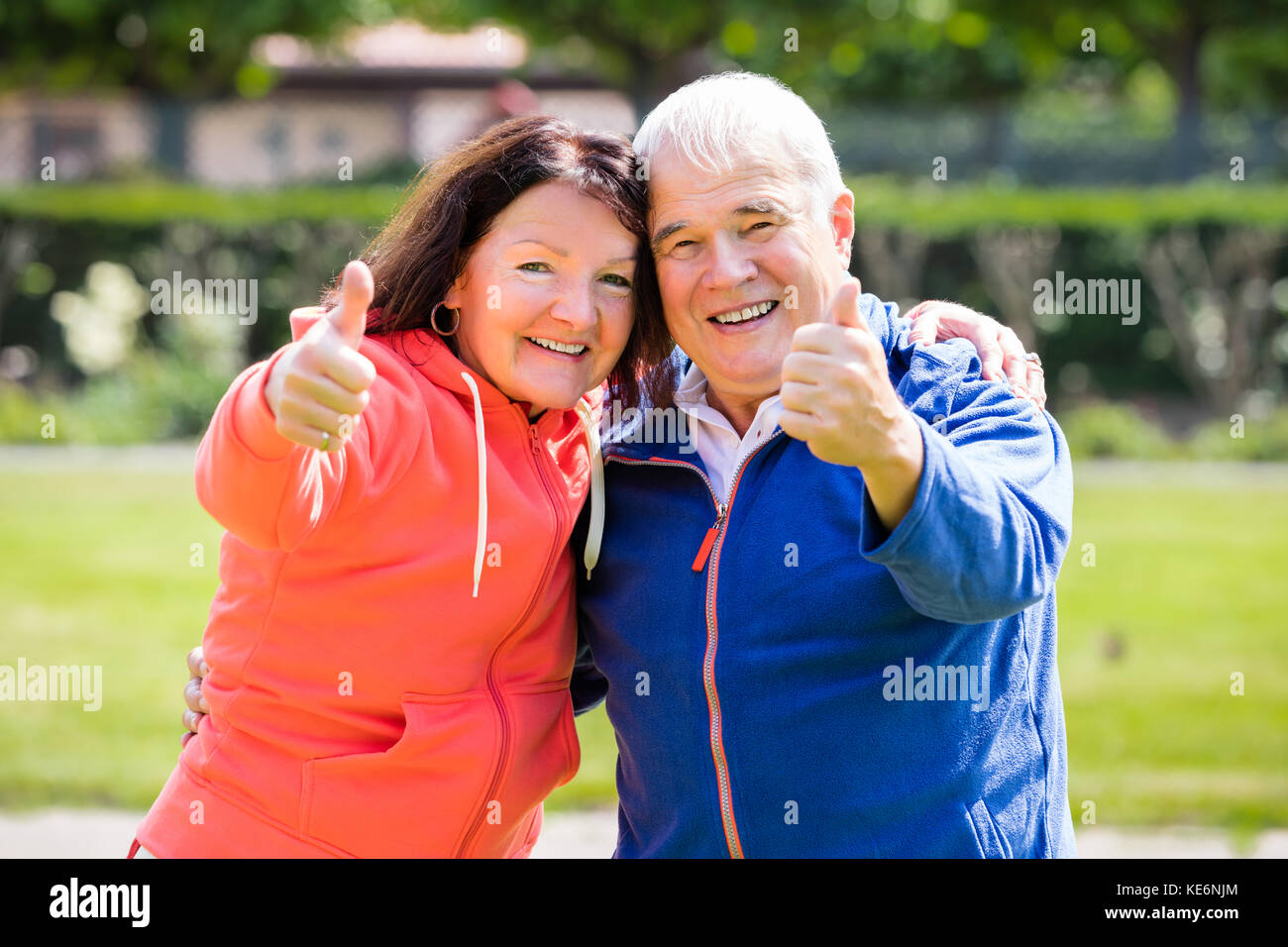 Portrait Of Smiling Senior Couple Showing Thumbs Up Stock Photo